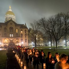 Participants form a candlelight procession following a prayer service in the Main Building in observation of Martin Luther King Jr. Day.