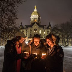 Students and staff walk out of the Main Building after a midnight prayer service in honor of the Rev. Martin Luther King Jr. holiday.
