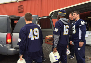 Notre Dame football players helped pack up these backpacks at the Food Bank of Northern Indiana