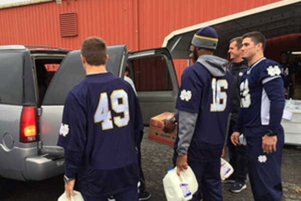 Notre Dame football players helped pack up these backpacks at the Food Bank of Northern Indiana