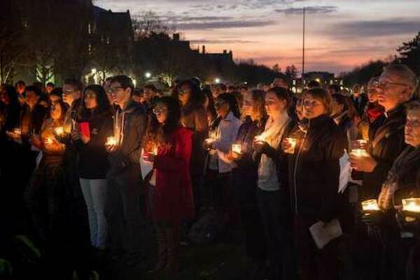 Prayer service outside of O’Shaughnessy Hall, at the Ivan Mestrovic sculpture of Christ and the Samaritan Woman at the Well