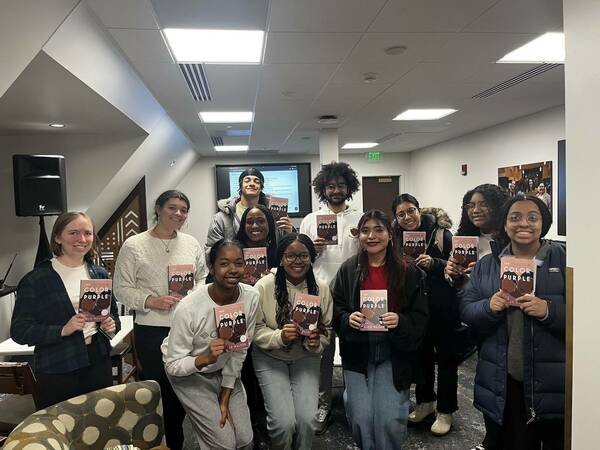 Book club participants with their copies of The Color Purple