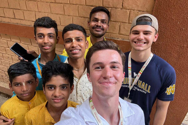 Ty Harrington smiles with a group of friends in India.